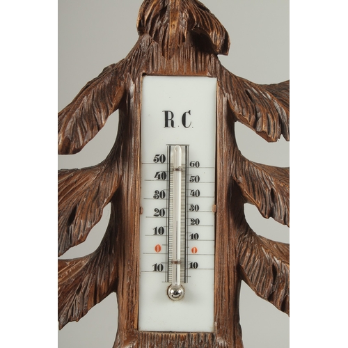 1207 - A GOOD CARVED BLACK FOREST CLOCK AND THERMOMETER carved with two bears. 5ins high.