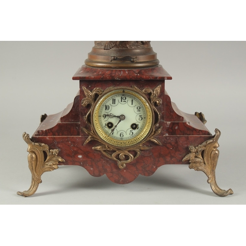 1209 - A 19TH CENTURY RED MARBLE AND SPELTER GROUP MANTLE CLOCK with key and pendulum. 22ins high.