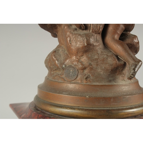 1209 - A 19TH CENTURY RED MARBLE AND SPELTER GROUP MANTLE CLOCK with key and pendulum. 22ins high.