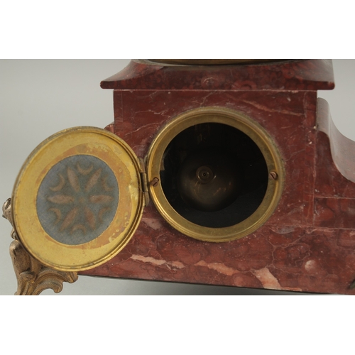 1209 - A 19TH CENTURY RED MARBLE AND SPELTER GROUP MANTLE CLOCK with key and pendulum. 22ins high.