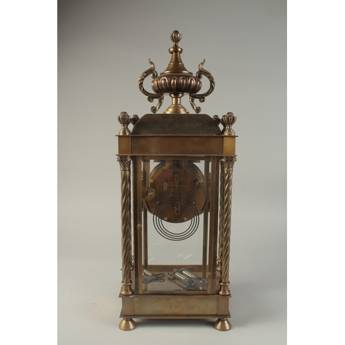 1211 - A 19TH CENTURY FRENCH BRONZE FOUR GLASS CLOCK with urn finial and twist column sides. 1ft 10ins high... 