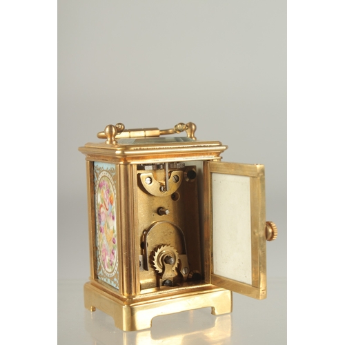 1213 - A GOOD MINIATURE BLUE AND GILT FACED BRASS CARRIAGE CLOCK. 2ins high