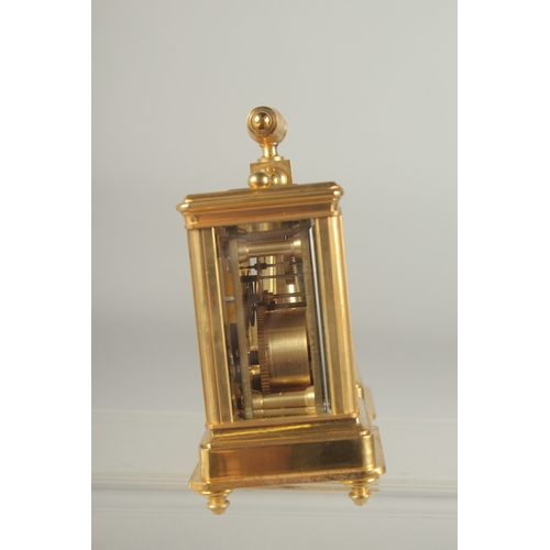 1215 - A GOOD MINIATURE BRONZE DOUBLE CARRIAGE CLOCK AND BAROMETER with carrying handle. 4ins high.