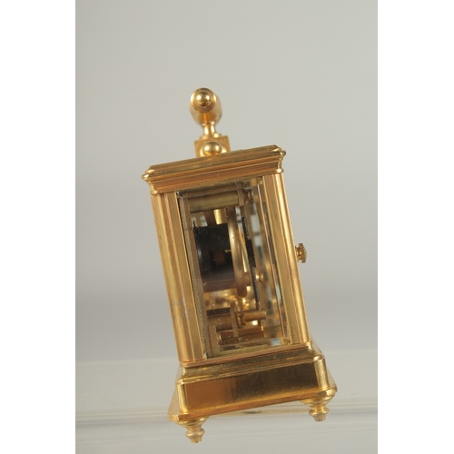 1215 - A GOOD MINIATURE BRONZE DOUBLE CARRIAGE CLOCK AND BAROMETER with carrying handle. 4ins high.