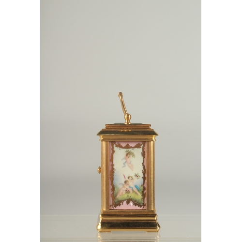 1216 - A GOOD MINIATURE PINK PORCLELAIN MULTI DIAL CARRIAGE CLOCK. 3ins high.