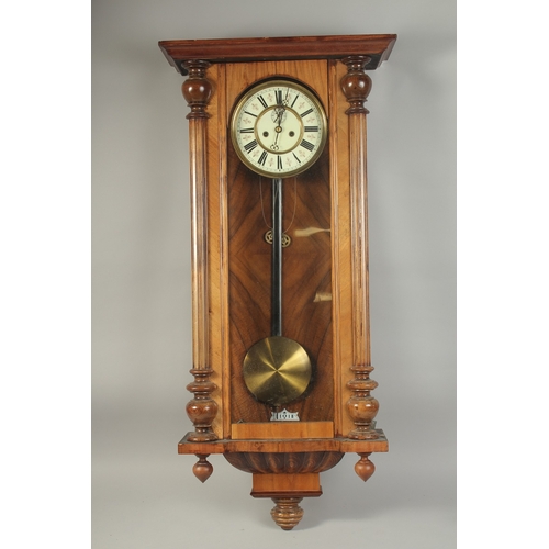 1223 - A VICTORIAN MAHOGANY HANGING WALL CLOCK with cream dial, Roman numerals and brass pendulum with two ... 