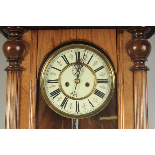 1223 - A VICTORIAN MAHOGANY HANGING WALL CLOCK with cream dial, Roman numerals and brass pendulum with two ... 