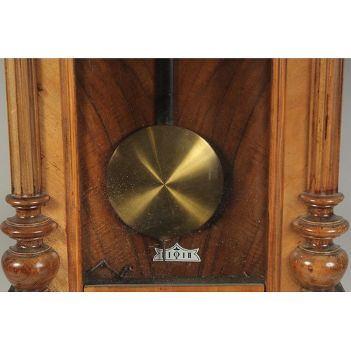 1223 - A VICTORIAN MAHOGANY HANGING WALL CLOCK with cream dial, Roman numerals and brass pendulum with two ... 