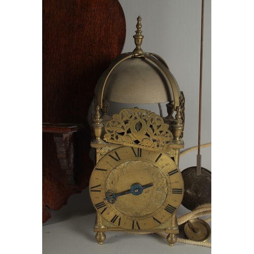 1227 - A GOOD 17TH - 18TH CENTURY BRASS LANTERN CLOCK with bell top and single hand. 16ins high, 5.5ins squ... 