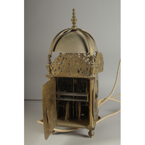 1227 - A GOOD 17TH - 18TH CENTURY BRASS LANTERN CLOCK with bell top and single hand. 16ins high, 5.5ins squ... 