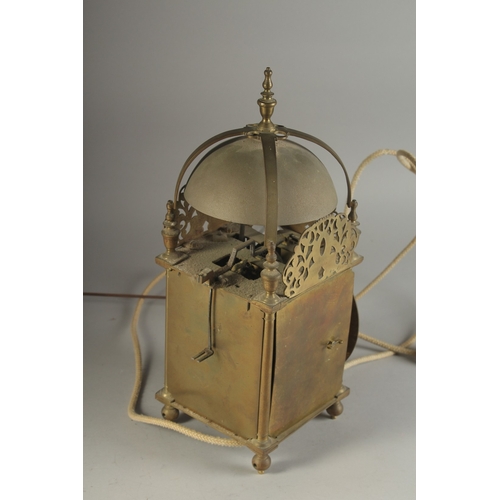 1227 - A GOOD 17TH - 18TH CENTURY BRASS LANTERN CLOCK with bell top and single hand. 16ins high, 5.5ins squ... 