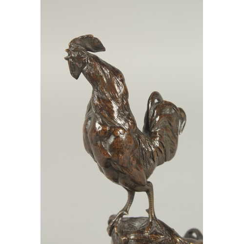 1242 - AUGUSTE NICHOLAS CAIN (1822 - 1994) FRENCH. A BRONZE COCKERAL STANDING IN A FARMYARD BASKET with a c... 