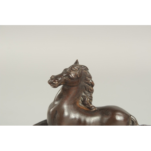 1245 - FRENCH SCHOOL (CIRCA. 1860) A SMALL BRONZE HORSE.  8cm high on a yellow marble base.