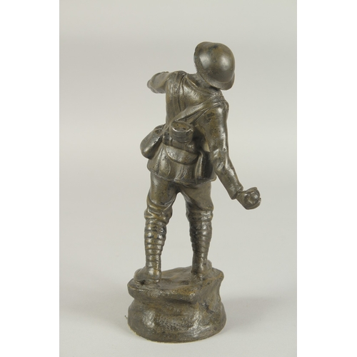 1248 - A BRONZE GRENADIER, WORLD WAR ONE, throwing a grenade, standing on a circular base. 26cm high.