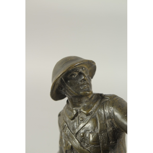 1248 - A BRONZE GRENADIER, WORLD WAR ONE, throwing a grenade, standing on a circular base. 26cm high.