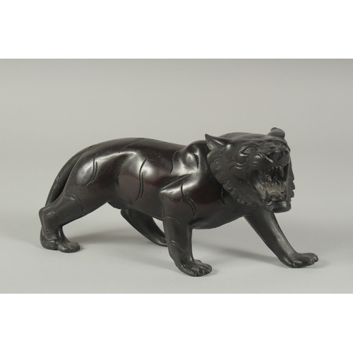 1251 - A BRONZE TIGER.  9.5ins long.