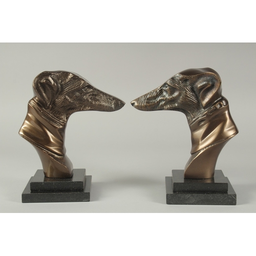 1252 - A PAIR OF BRONZE GREYHOUNDS HEADS on stepped bases.  8.5ins high.