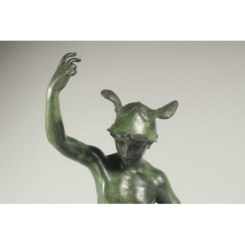 1264 - GIAMBOLOGNA AN EARLY BRONZE FIGURE OF MERCURY. Signed on a circular base. 21ins high.