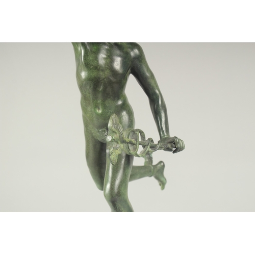 1264 - GIAMBOLOGNA AN EARLY BRONZE FIGURE OF MERCURY. Signed on a circular base. 21ins high.