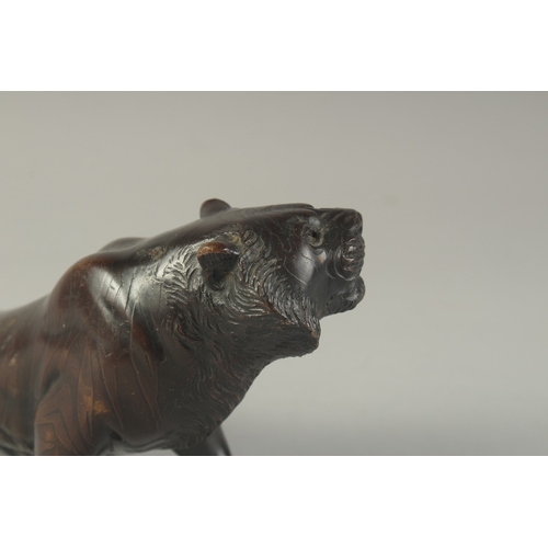 1270 - A JAPANESE BRONZE TIGER Signed 9.5ins long.