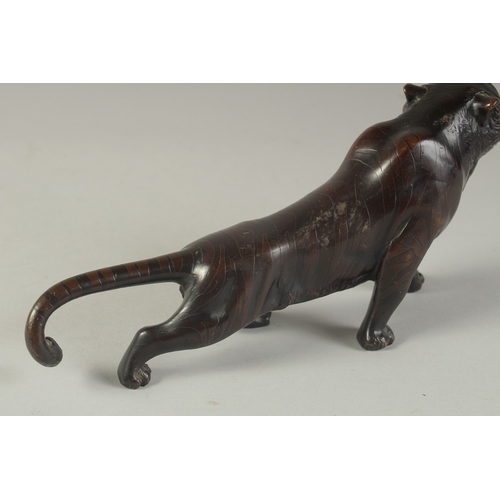 1270 - A JAPANESE BRONZE TIGER Signed 9.5ins long.