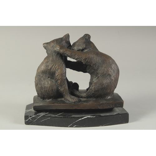 1272 - A CAST BRONZE GROUP OF TWO PLAYFUL BEARS on a  marble base. 7ins high.