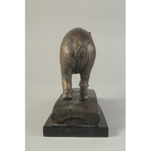 1273 - A BRONZE ELEPHANT on a marble base. 8ins high.