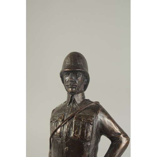 1274 - A SPELTER FIGURE OF A SOLDIER on a wooden base. 9ins high.