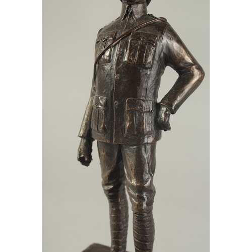 1274 - A SPELTER FIGURE OF A SOLDIER on a wooden base. 9ins high.