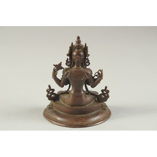 1275 - A SMALL BRONZE TIBETAN SEATED MULTI ARM  BUDDHA. 3.75ins high.