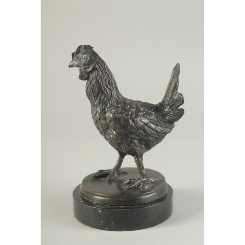 1278 - A BRONZE MODEL OF A CHICKEN on a circular marble base. 7.5ins high.