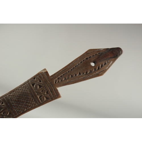 1283 - A CARVED WOOD LONG  SPOON. 15ins long.