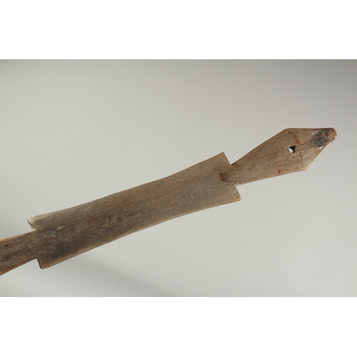 1283 - A CARVED WOOD LONG  SPOON. 15ins long.