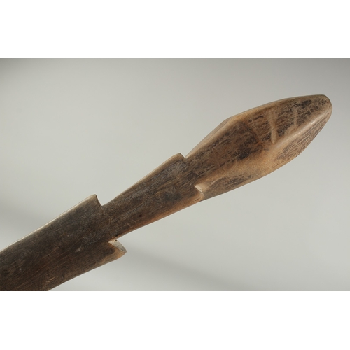 1283 - A CARVED WOOD LONG  SPOON. 15ins long.