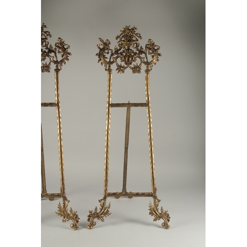 1291 - A LARGE PAIR OF BRASS EASLES. 2ft 8ins long.