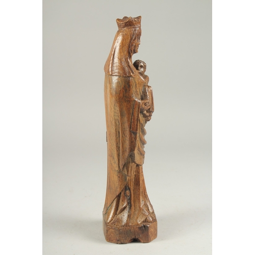 1306 - AN 18TH CENTURY CARVED WOOD MADONNA AND CHILD. 12ins high.