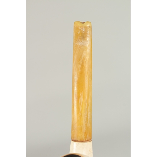 1326 - A LARGE MEERSCHAMP PIPE, the bowl,  the head of an Arab, with carved stem and amber mouth piece. 10i... 