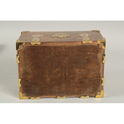 1328 - A GOOD 19TH CENTURY FIGURED WALNUT BRASS BOUND CASKET with velvet interior. 8ins long.