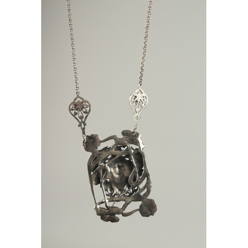 1573 - A SILVER NOUVEAU STYLE GIRL NECKLACE.