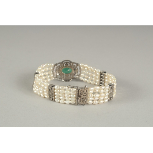 1574 - A GOOD DIAMOND, EMERALD AND FIVE ROW PEARL BRACELET.