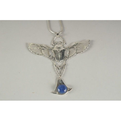 1585 - A DECO STYLE SILVER LAPIS BAT PENDANT AND CHAIN.