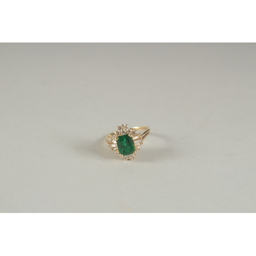 1594 - A GOOD YELLOW GOLD EMERALD AND DIAMOND RING.