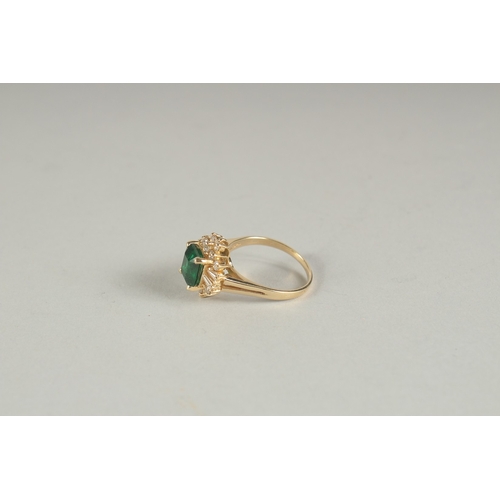 1594 - A GOOD YELLOW GOLD EMERALD AND DIAMOND RING.