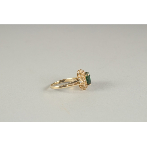 1594 - A GOOD YELLOW GOLD EMERALD AND DIAMOND RING.