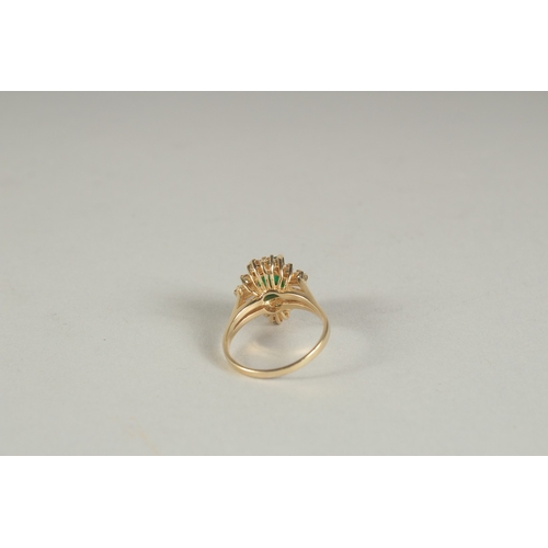 1594 - A GOOD YELLOW GOLD EMERALD AND DIAMOND RING.