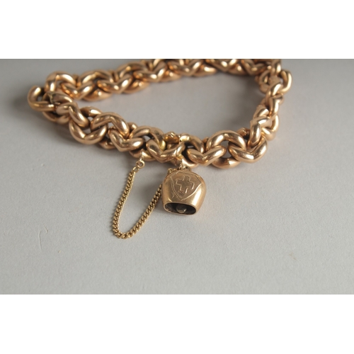 1595 - A 15CT GOLD CHAIN LINK BRACELET and a charm. Weight: 28.9gms.