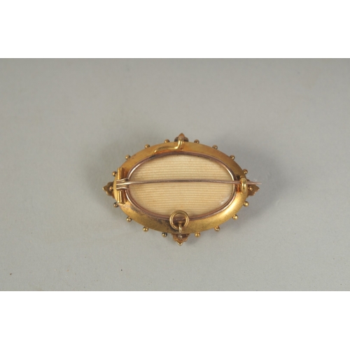 1596A - A MATCHING 15CT GOLD BROOCH AND PENDANT with blue enamel and seed pearls.