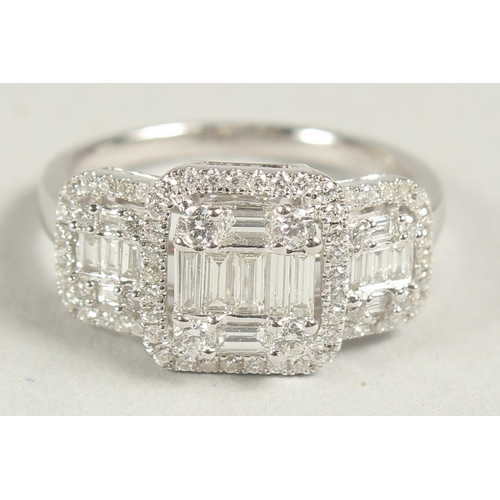 1600 - A SUPERB 14CT WHITE GOLD DECO DESIGN TRIPLE CLUSTER DIAMOND RING. Size N.