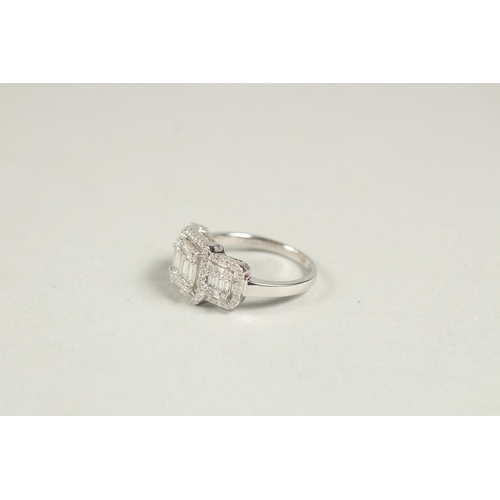 1600 - A SUPERB 14CT WHITE GOLD DECO DESIGN TRIPLE CLUSTER DIAMOND RING. Size N.