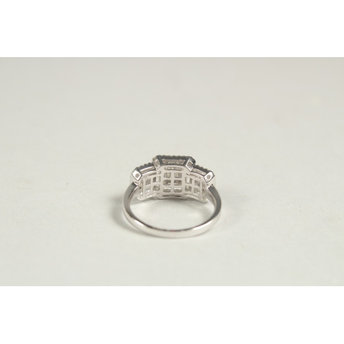 1600 - A SUPERB 14CT WHITE GOLD DECO DESIGN TRIPLE CLUSTER DIAMOND RING. Size N.